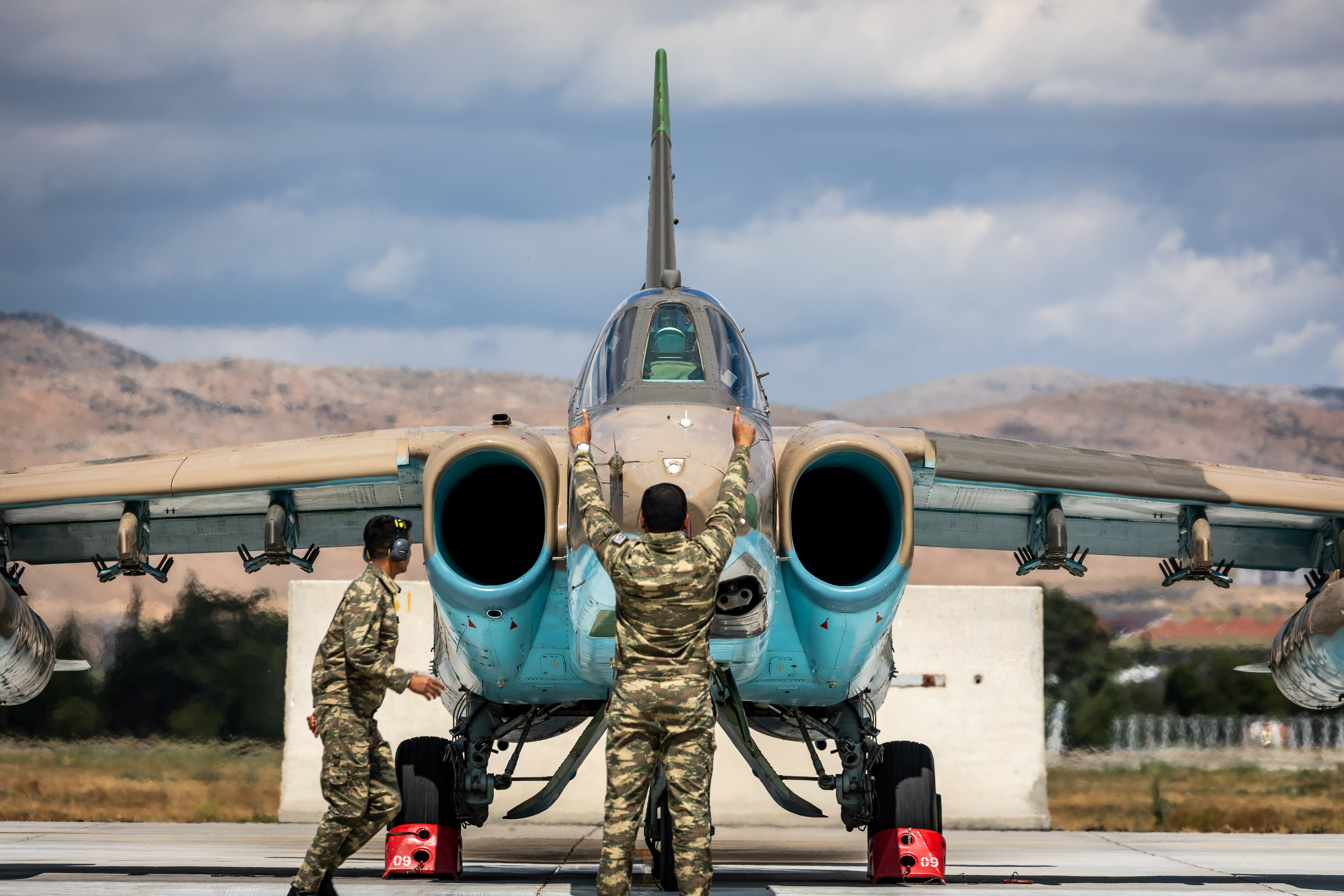 Image shows aviators directing Typhoon aircraft on the airfield.